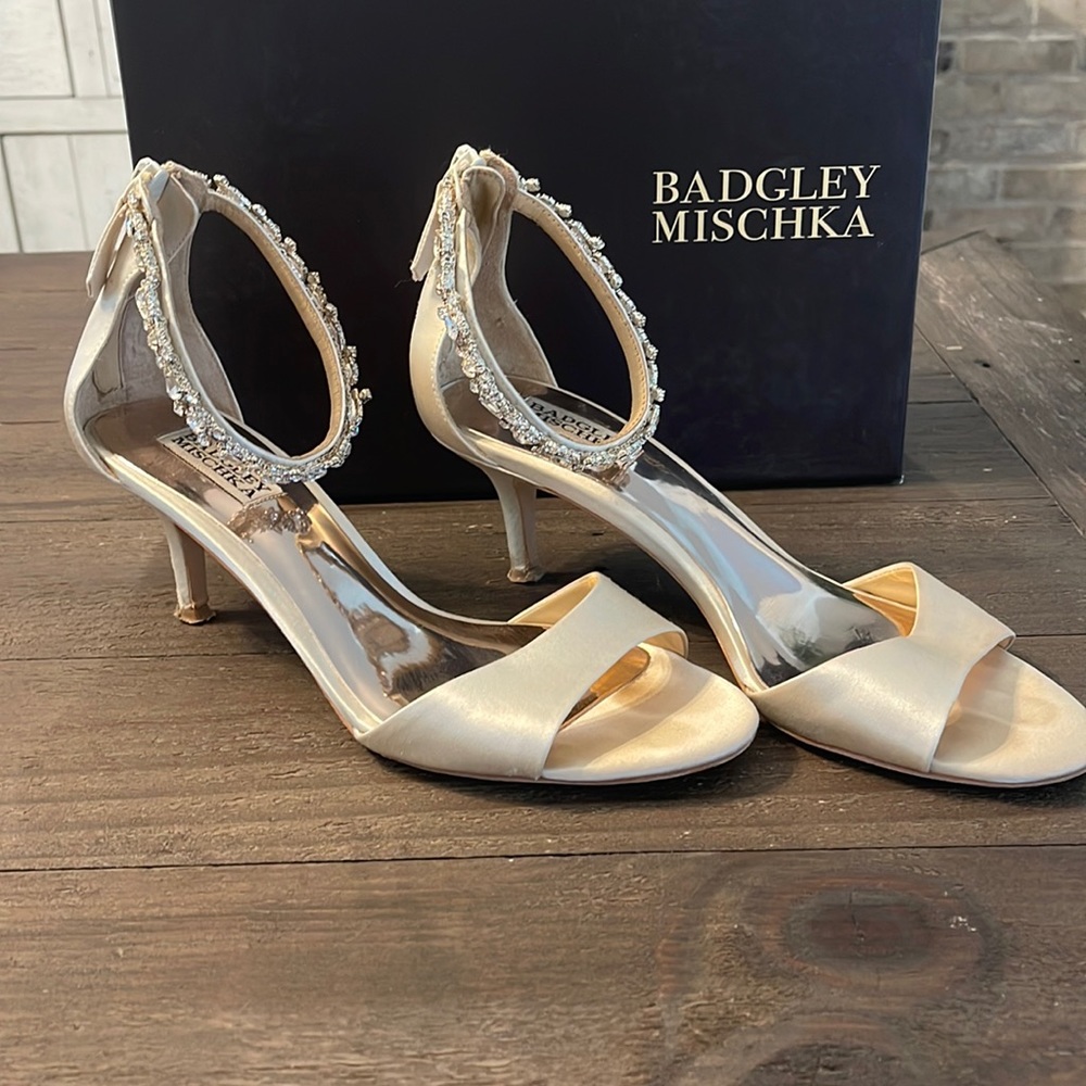 Badgley Mischka cream satin shoes with jewels.